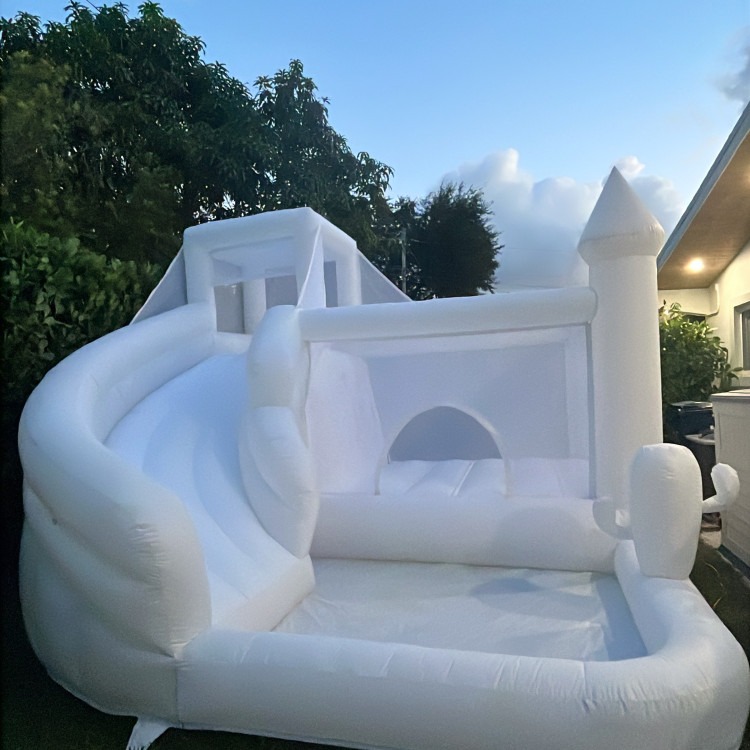White bounce house with slide